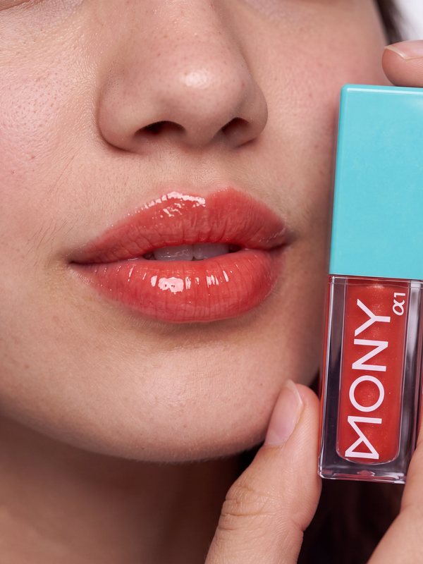 Beauty category: glossy lips next to the product
